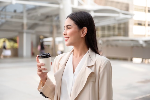 Portrait of young beautiful businesswoman in modern city