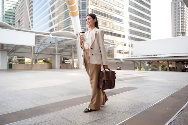 Portrait of young beautiful businesswoman in modern city