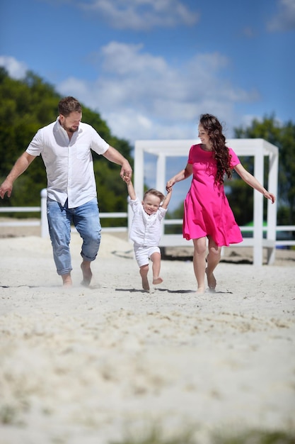 Portrait of a young beautiful family with pregnant mother