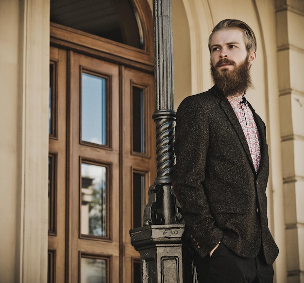 Portrait of young beautiful fashionable man outdoor