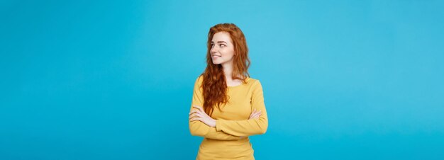 Portrait of young beautiful ginger woman with freckles cheerfuly smiling looking at camera isolated