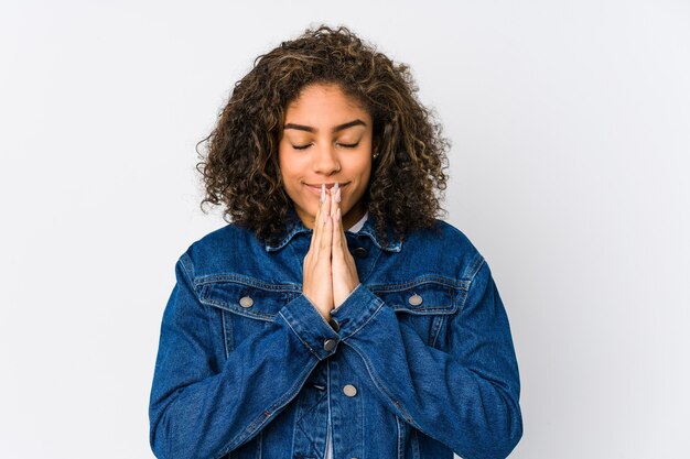 Portrait of a young beautiful girl praying