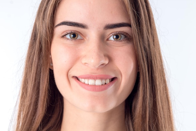 Portrait of a young beautiful girl smiling close-up