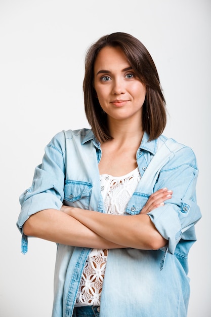 Portrait of young beautiful girl over white background