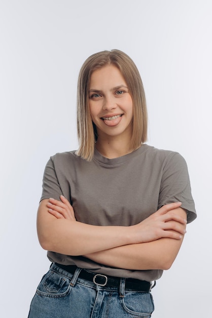 Photo portrait of a young beautiful girl with braces on a white background