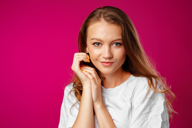 Portrait of a young beautiful happy woman smiling close up