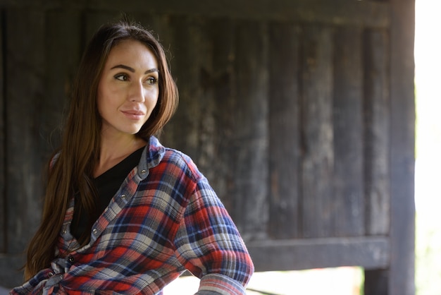 Portrait of young beautiful hipster woman in the city streets outdoors