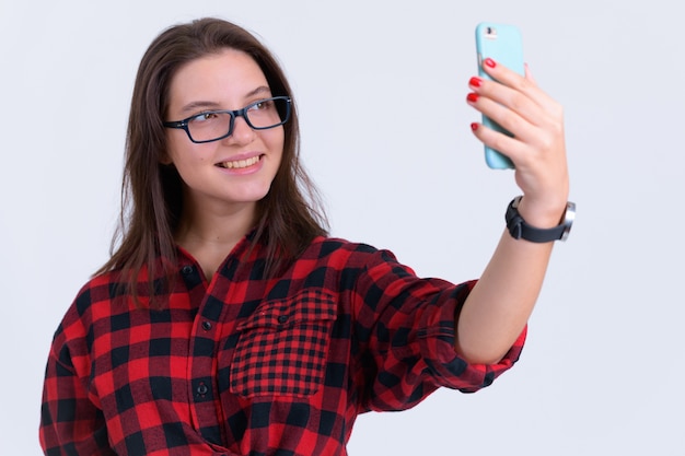 Portrait of young beautiful hipster woman on white