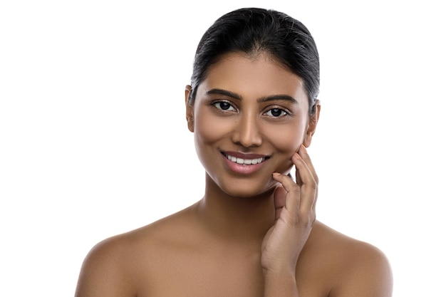 Portrait of young and beautiful Indian woman with a smooth skin on white background