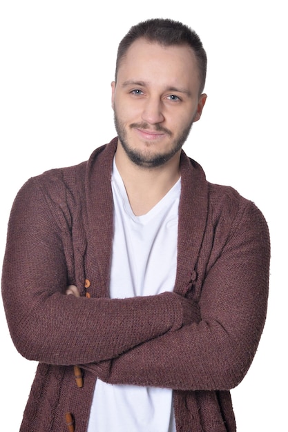 Portrait of young beautiful man posing isolated on white background