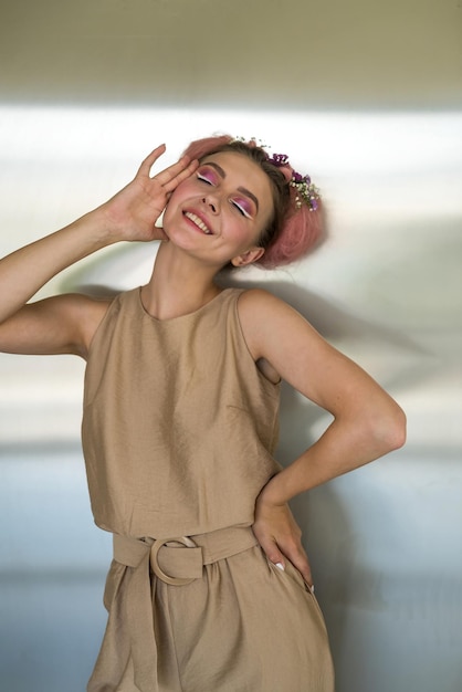 Portrait of a young beautiful pretty woman with professional makeup in a modern fashionable beige suit