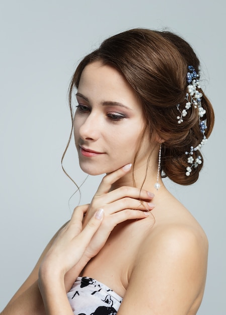 Portrait of a young beautiful smiling brown haired woman.