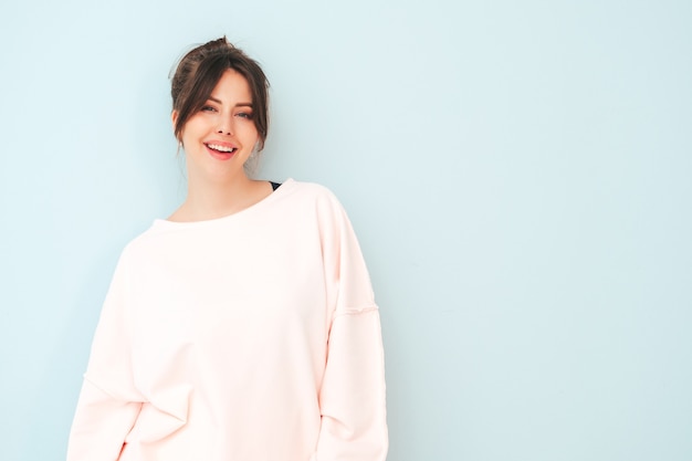 Portrait of young beautiful smiling female in trendy summer pink clothes