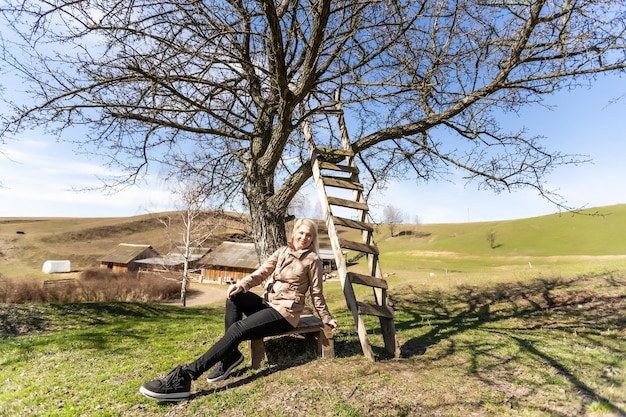 Portrait of the young beautiful smiling woman outdoors.