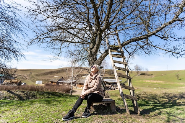 Portrait of the young beautiful smiling woman outdoors.