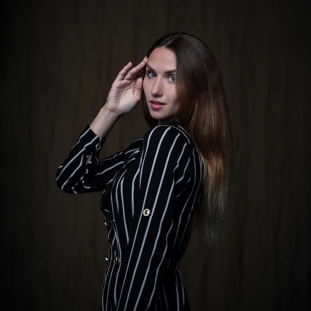 portrait of a young beautiful woman on a dark background