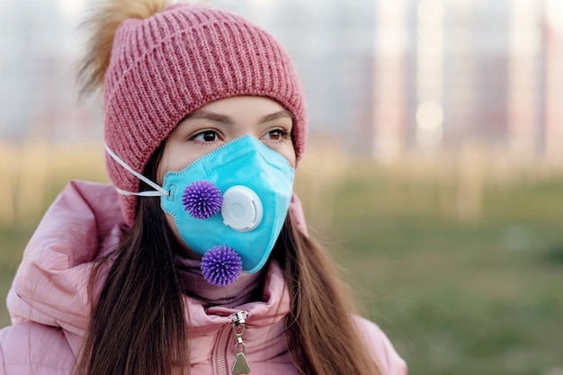 Portrait of young beautiful woman in medical mask