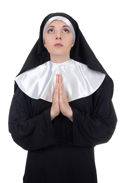 Portrait of young beautiful woman nun praying isolated on white background