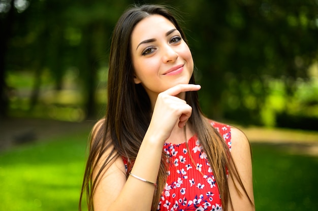 Portrait of a young beautiful woman outdoor in a park