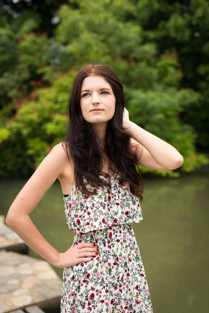 Portrait of young beautiful woman at the park outdoors