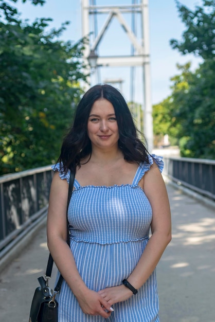 Portrait young beautiful woman with bridge