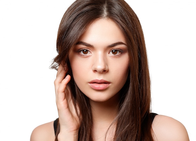 Portrait of a young beautiful woman with brown eyes