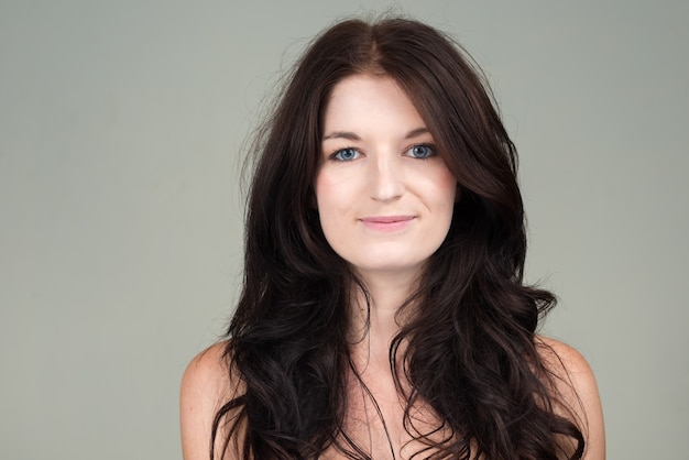 Portrait of young beautiful woman with brown hair