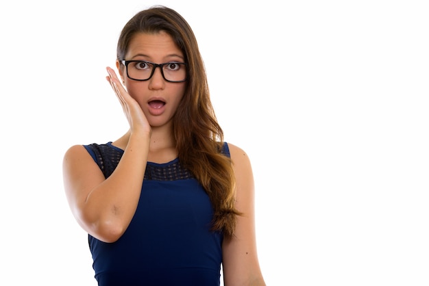 Portrait of young beautiful woman with eyeglasses looking surprised