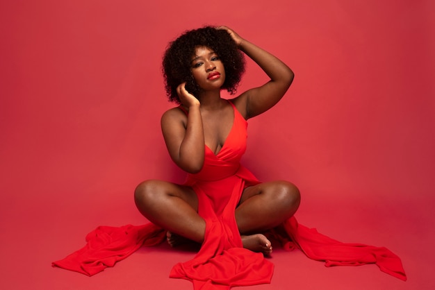 Photo portrait of young beautiful woman with red dress