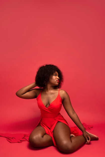 Photo portrait of young beautiful woman with red dress