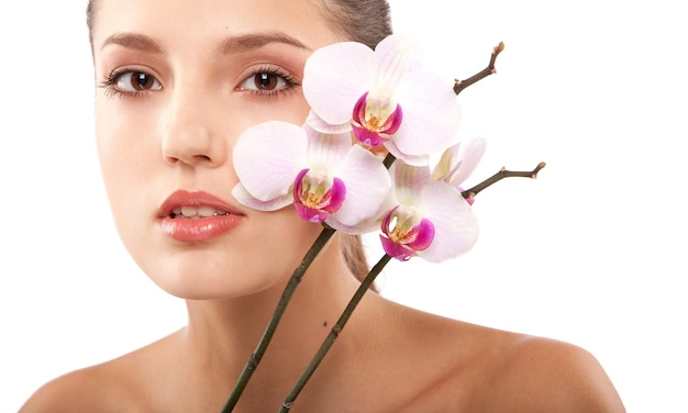 portrait of young beautiful woman with white orchid