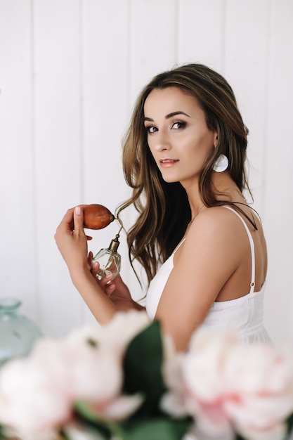 Photo portrait of a young beautiful woman. woman in white dress.