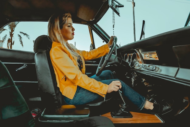 Portrait of young beautiful woman in yellow jacket