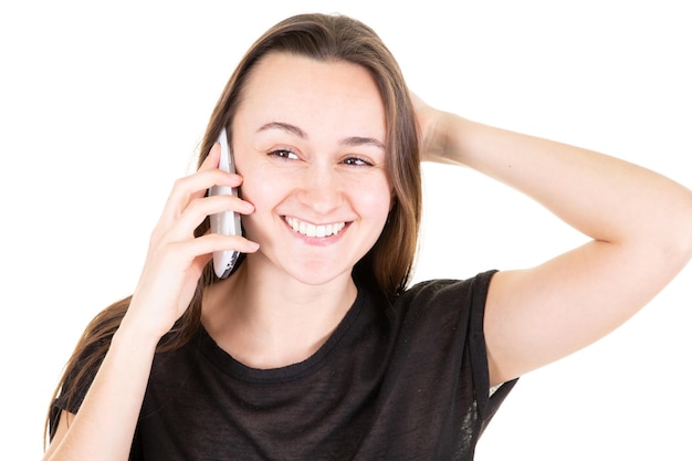 Photo portrait of young beautyful woman on phone looks in camera