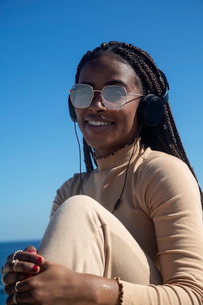 Portrait of young black girl smiling with headphones