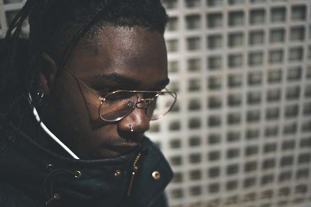 Photo portrait of young black man and handsome and modern in the street