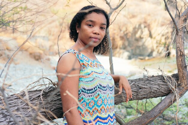 Portrait of a young Black woman standing in the open air