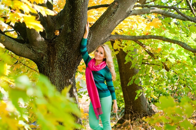 Portrait of young blond woman in autumn color