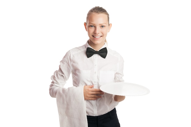 Portrait of young blonde waitress smiling at camera while holding tray and towel.Isolated.