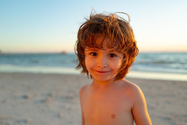 Portrait of young boy in nature sea or outdoors