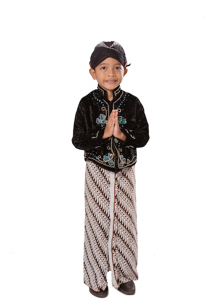 Portrait of a young boy wearing traditional Javanese clothes