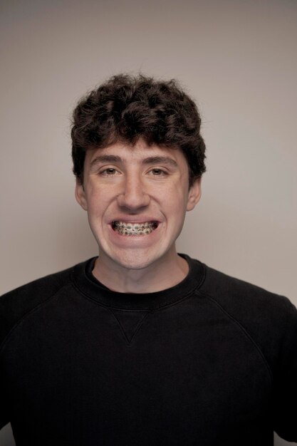 portrait of young boy with metal orthodontics