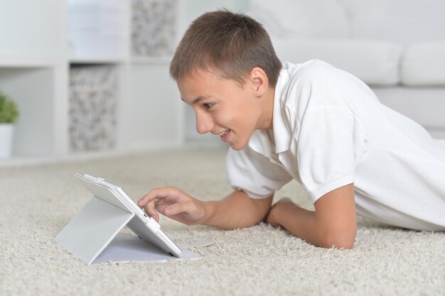 Portrait of a young boy with the tablet