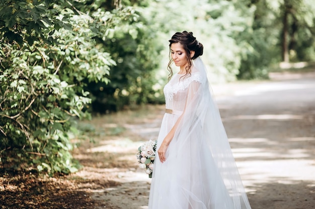 Portrait of a young bride posing in nature