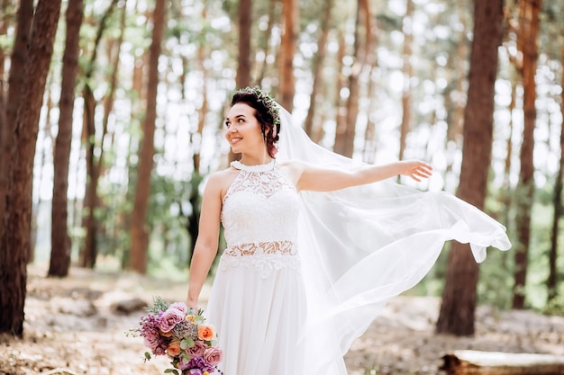 Portrait of a young bride posing in nature