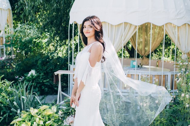 Portrait of a young bride posing in nature