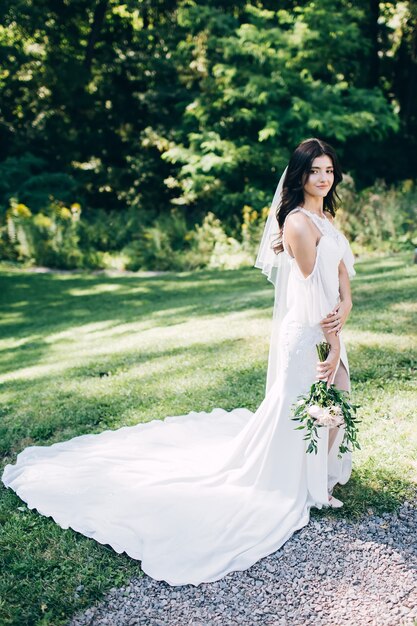 Portrait of a young bride posing in nature