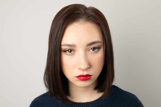 Portrait of a young brunette looking at the camera.