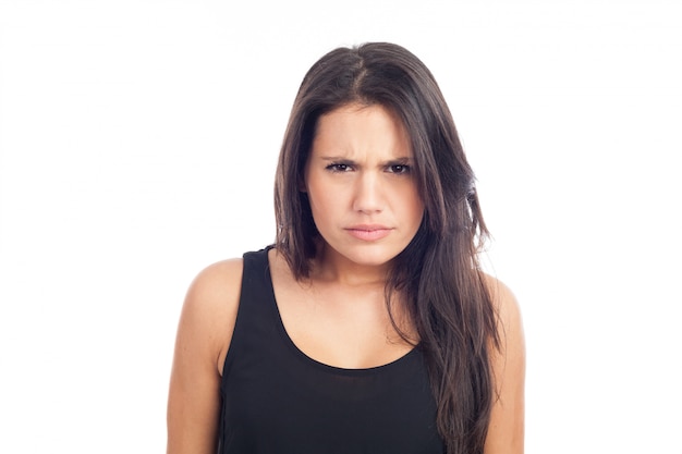 Portrait of a young brunette woman angry and angry