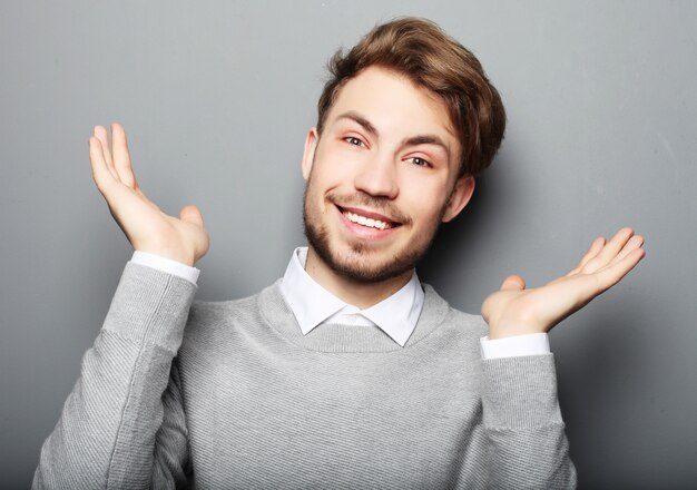 Portrait of a young business man surprised face expression